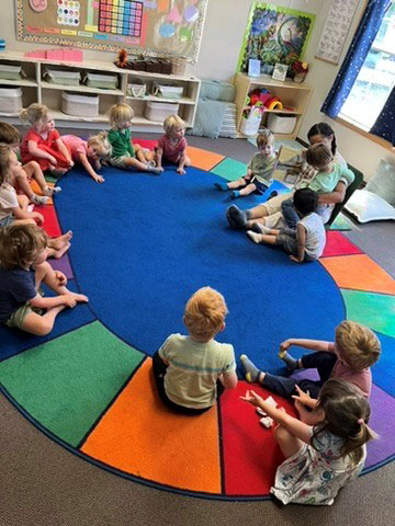 Children reading in a circle