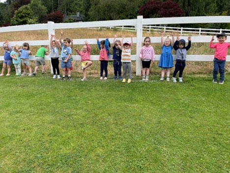 Children stretching outdoors