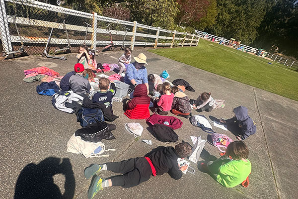 Children playing with chalk outdoors